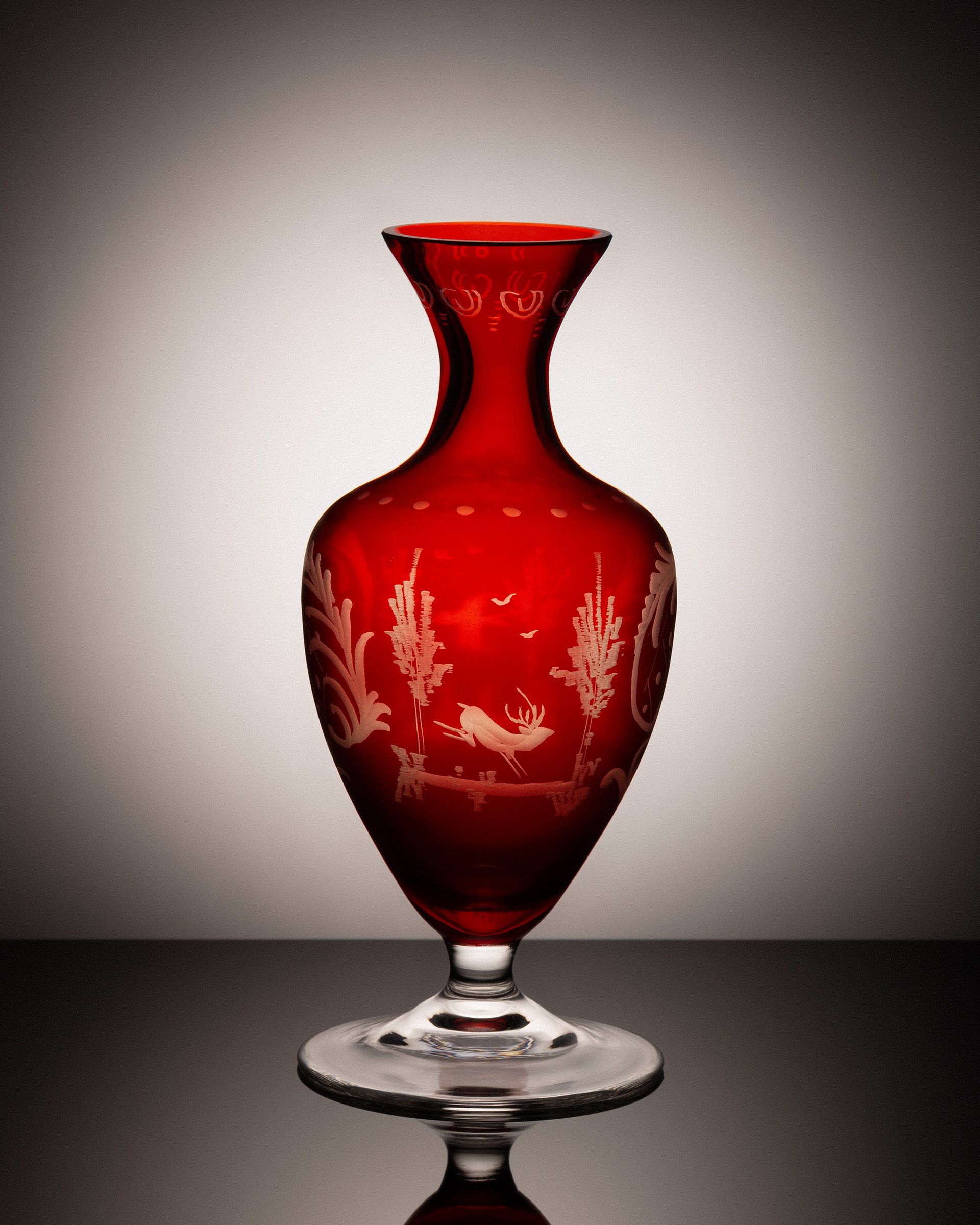 Antique red vase with engravings.