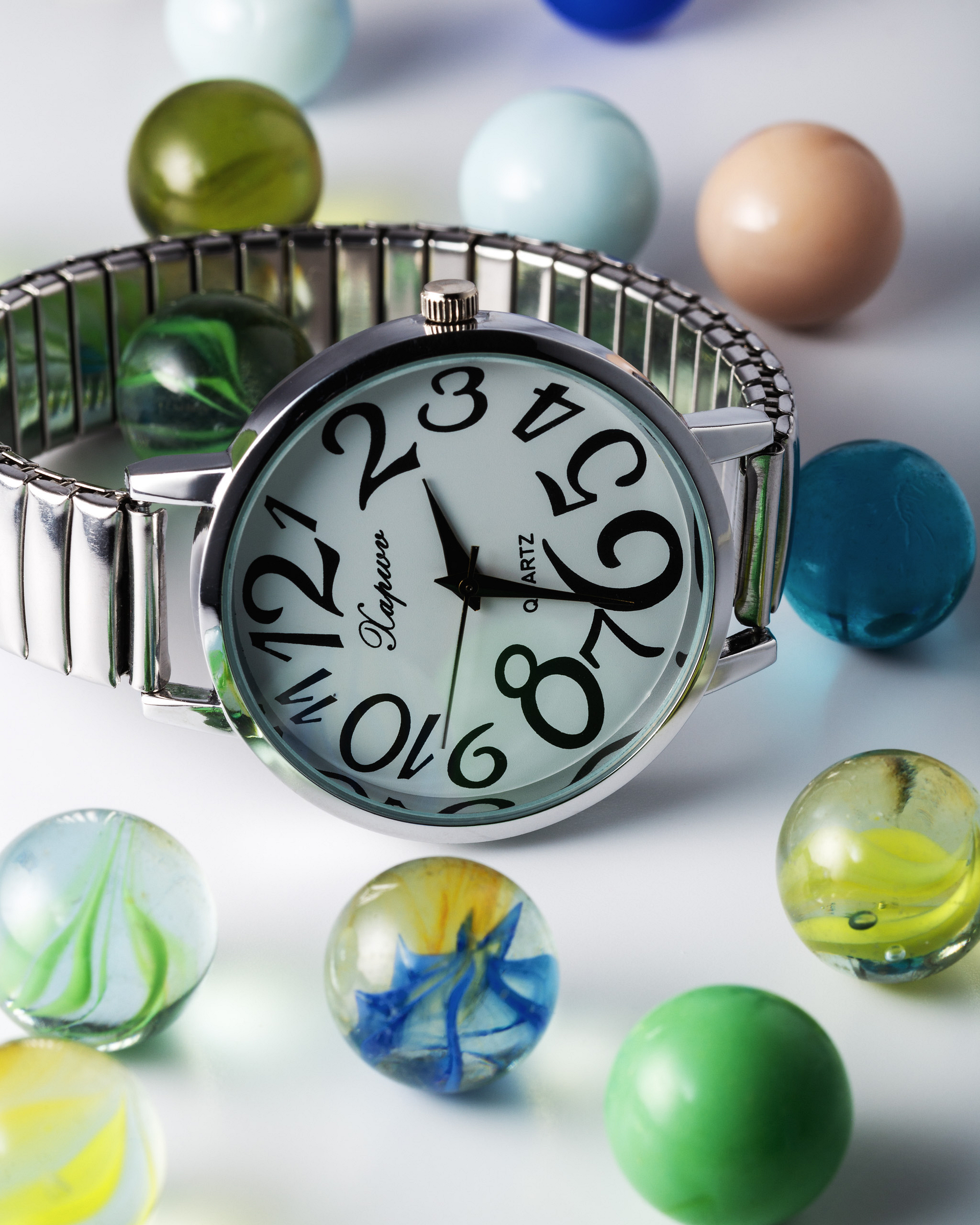 Chrome watch with marbles.