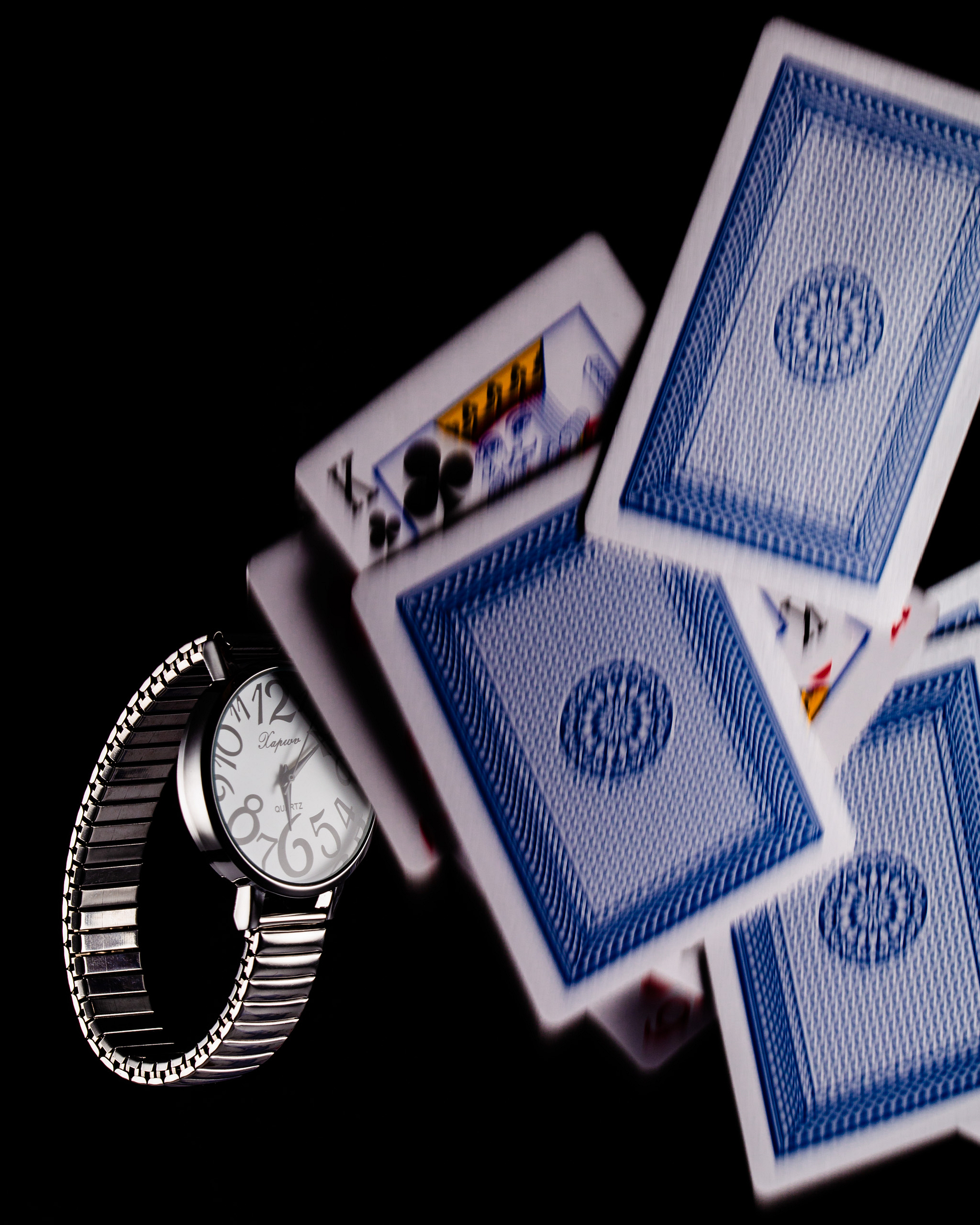 Watch with flying playing cards.