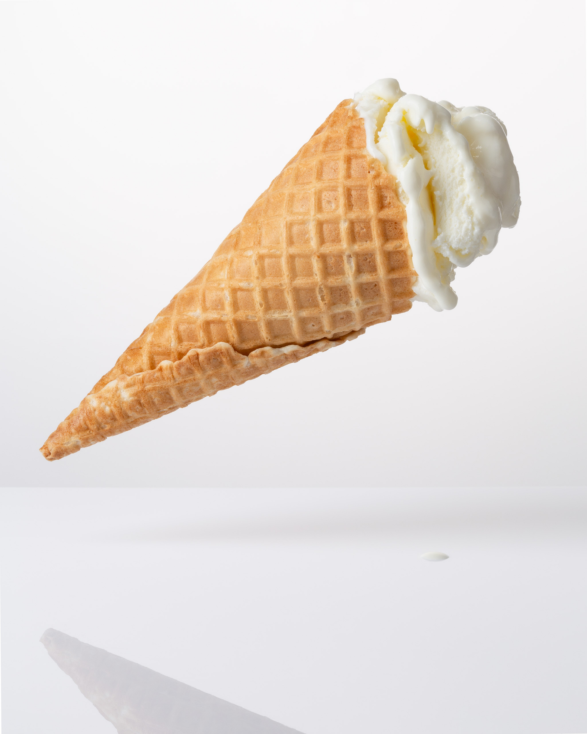 floating ice cream in a scone, melting, against a bright background and shadows