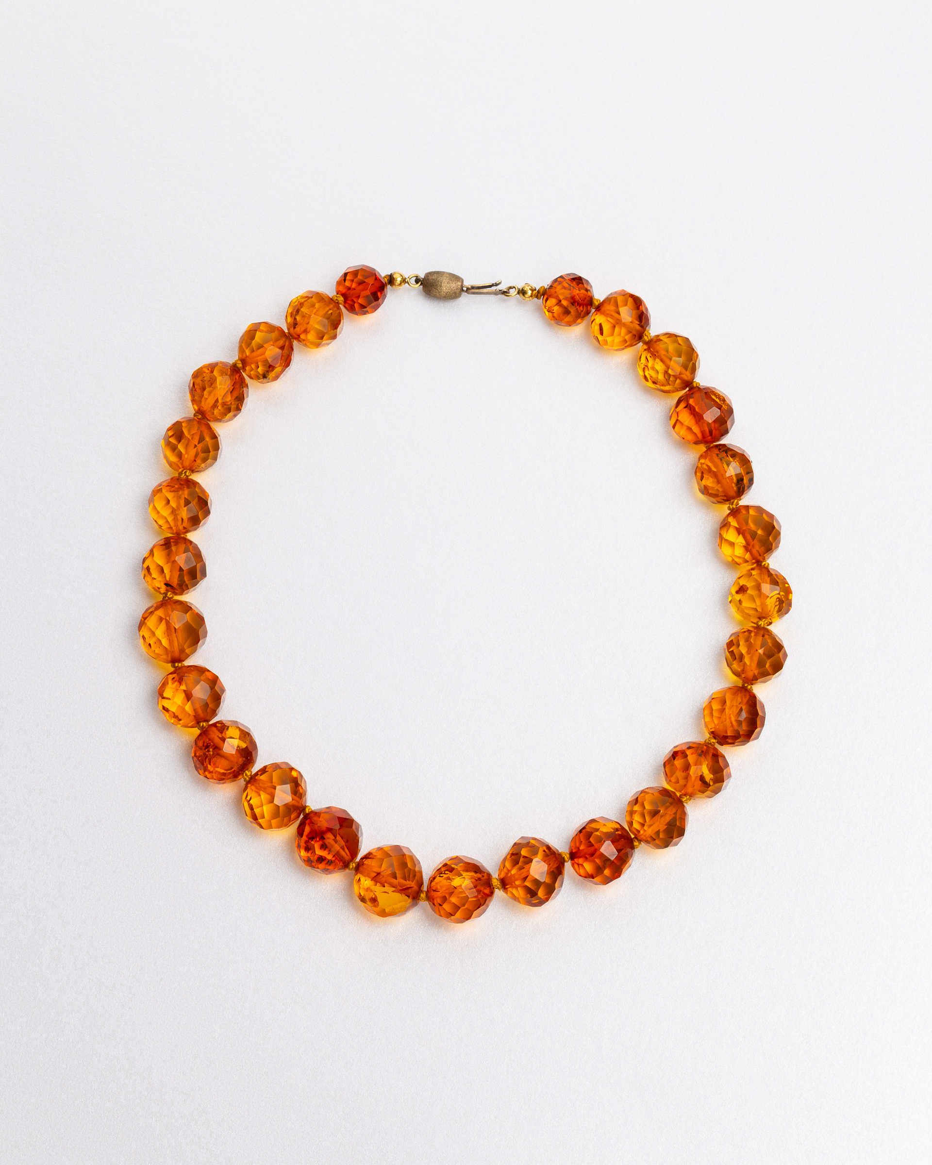 Amber necklace on a white background.