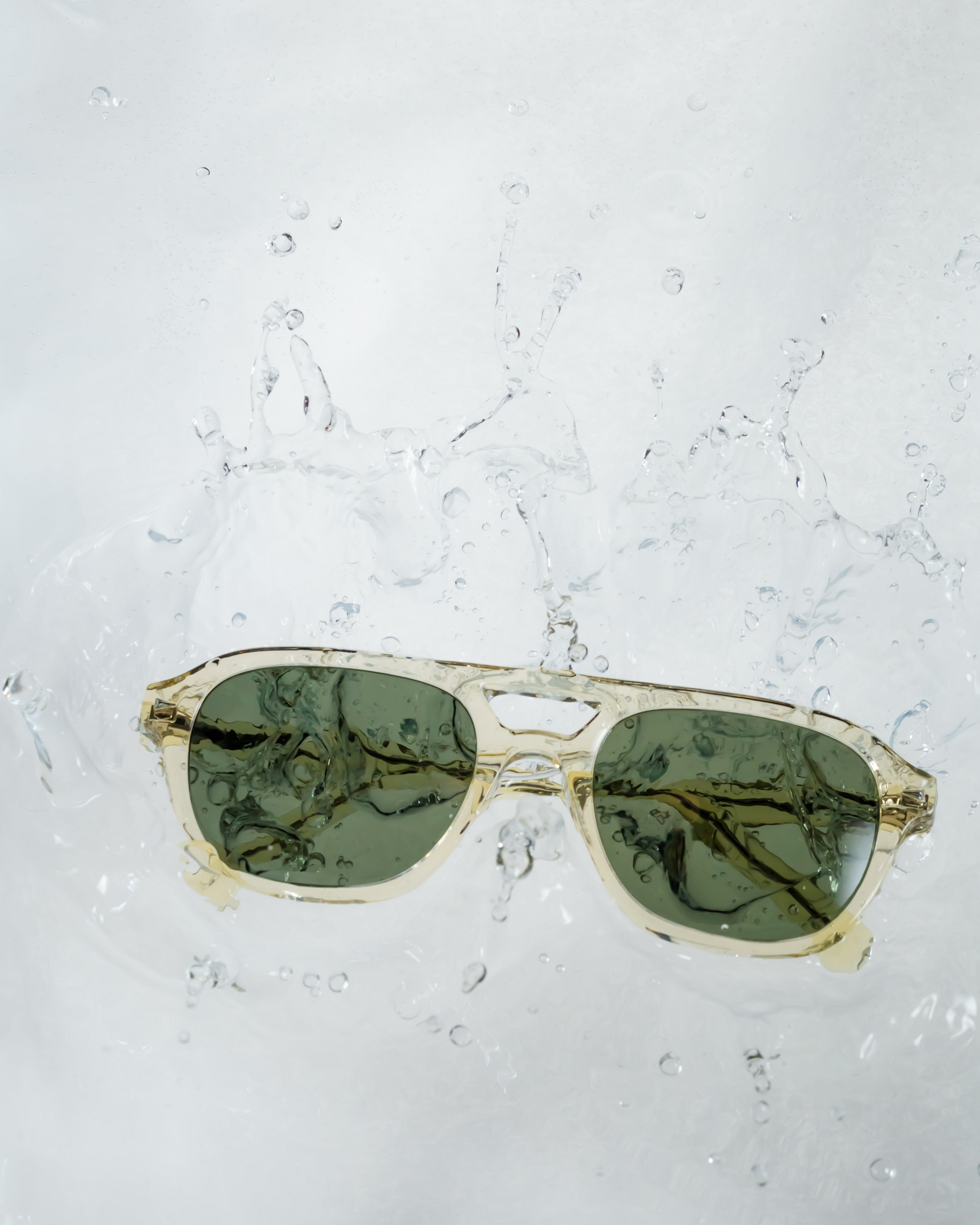 green sunglasses water splash