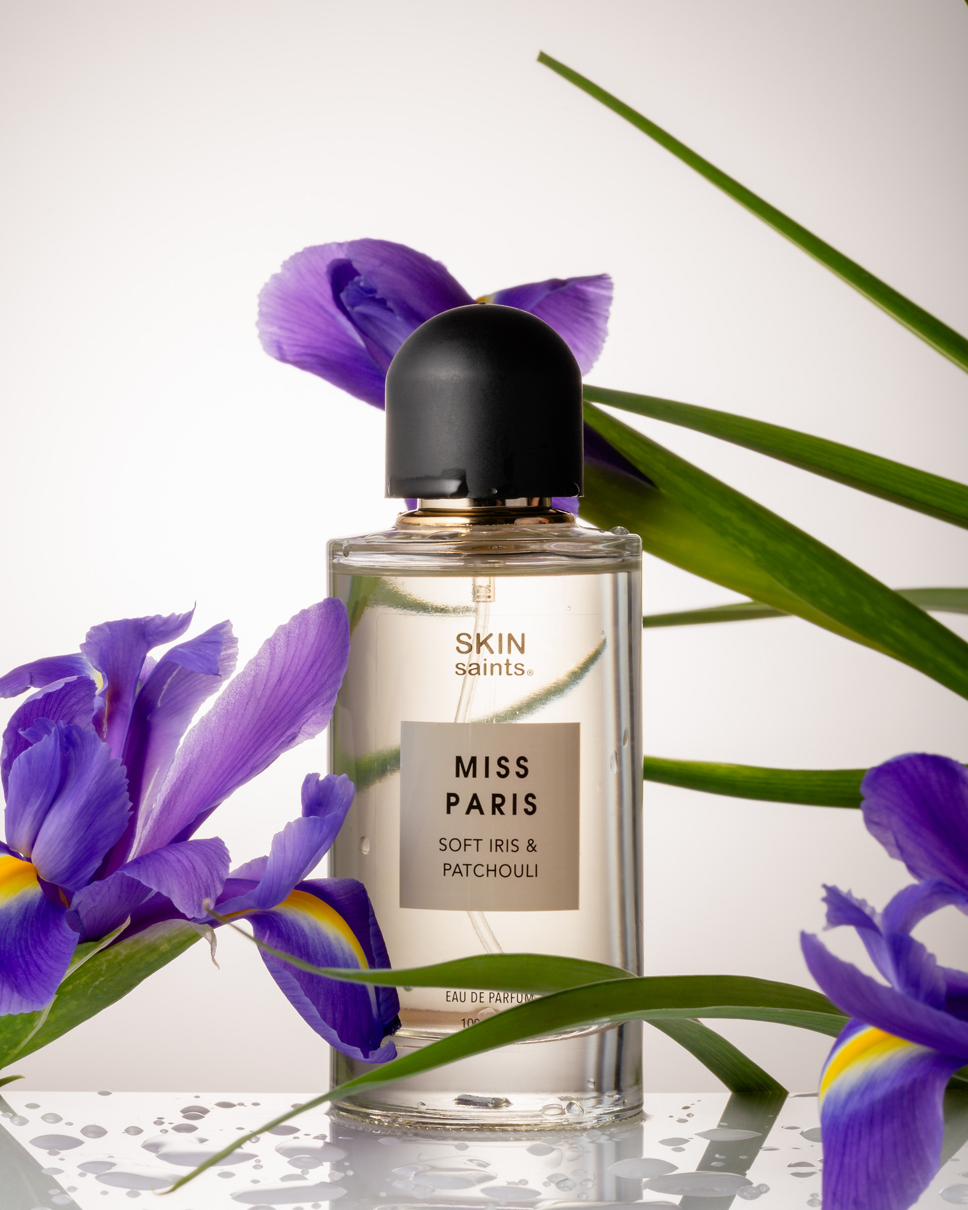 perfume bottle and iris with refractions