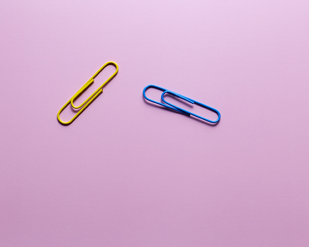 paperclips on pink background