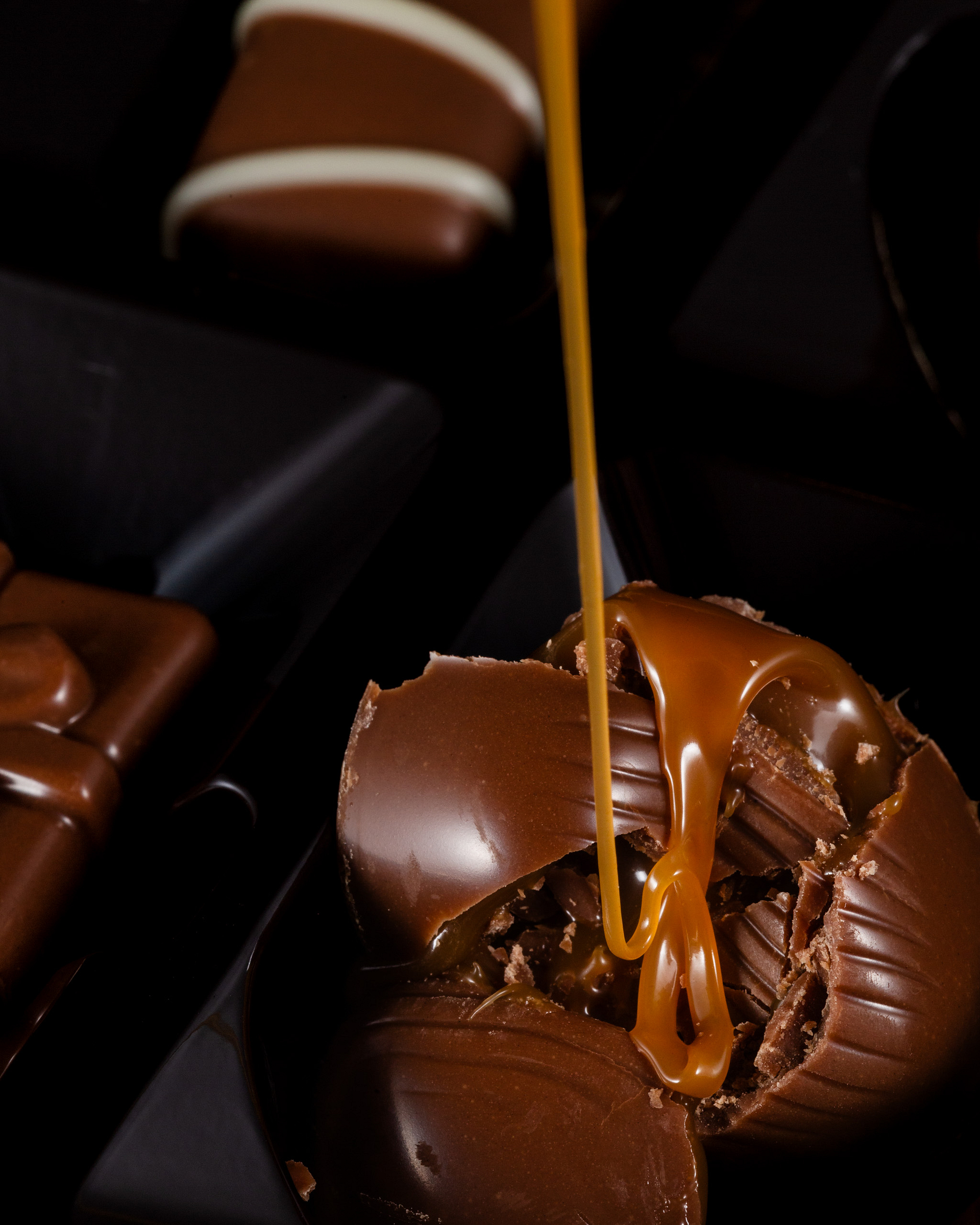 Open chocolate praline with caramel filling.